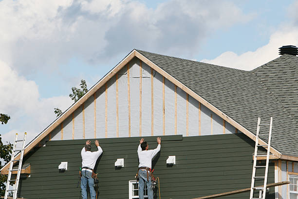 Professional Siding technician working in Fayville, MA
